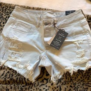 Low rise midi super stretch distressed shorts